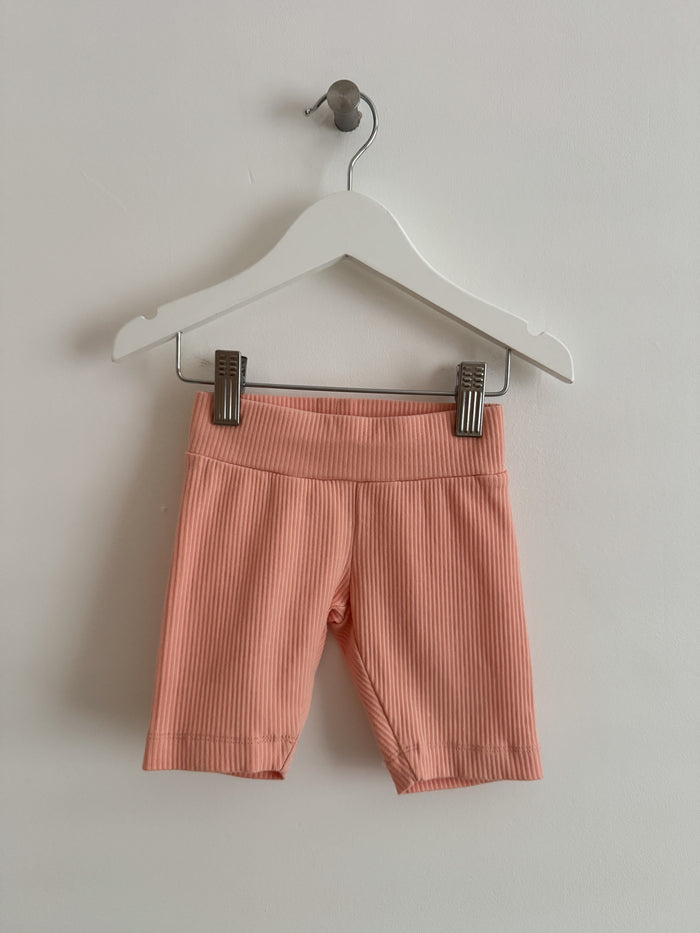 PRELOVED PEACH CYCLING SHORTS 1-2 YEARS